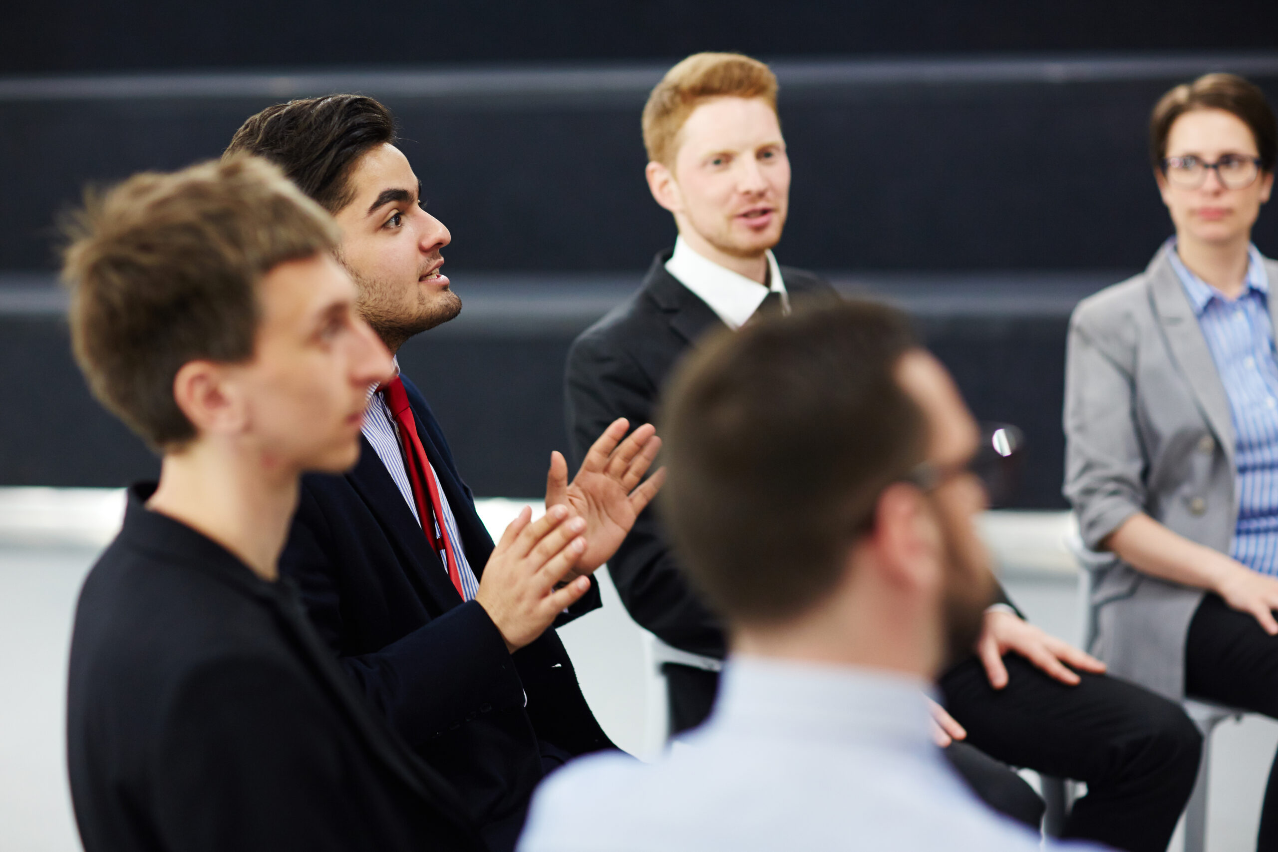 Discussion of confident professionals at business briefing
